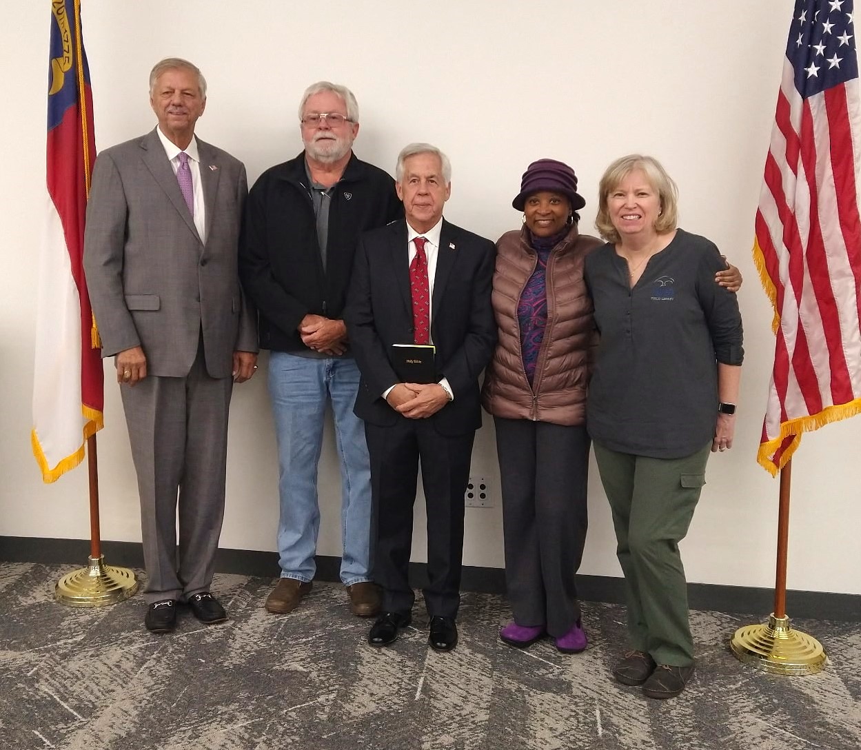 pictured is an image of the board members smiling and facing the camera pictured Left to Right: Danny Moody the Chairman, Rickie L. Day the Secretary, Allison Fenderson, Dewayne Lee and Betsy McCormick