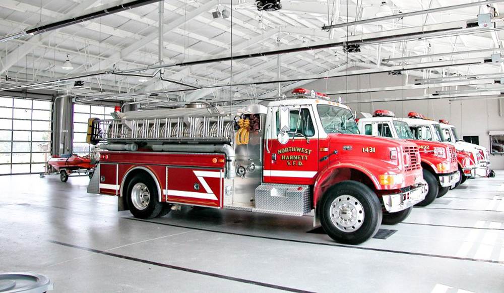 Fire trucks in a row parked at a station